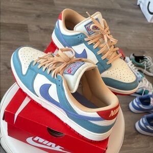 Nike Blue and Cream Sneakers with Red Accents